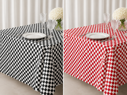 Two checkered tablecloths shown side by side: one black and white, one red and white, each styled with a white plate, wine glasses, and a vase of white flowers against a light curtain background.