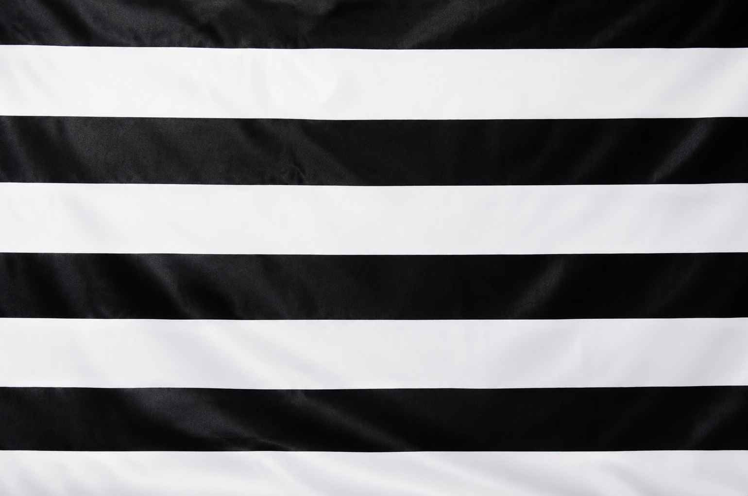 Black and white horizontally striped fabric texture filling the frame.