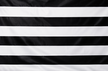 Black and white horizontally striped fabric texture filling the frame.