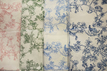A collection of satin print drapery panels displayed in three rows, with the top row featuring a red floral pattern, the middle row a blue floral pattern, and the bottom row a green floral pattern. Each panel is folded to show both sides of the fabric.