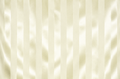 Close-up of a cream-colored fabric with a vertical satin-like stripe pattern and soft sheen.