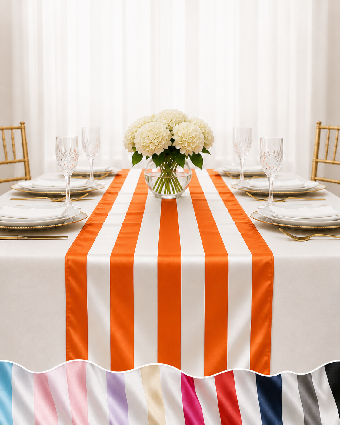 A white tablecloth with bold orange vertical stripes and a ruffled hem, styled on a dining table with white plates, wine glasses, a floral centerpiece, and gold chairs.